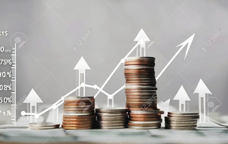 diversas moedas e graficos de investimento